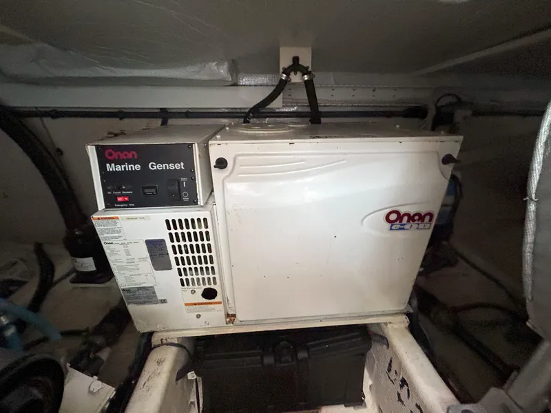 Slide: The Image of Engine compartment of a 2006 Sabre 38 Express HDTP MY boat, showcasing detailed components. - 36