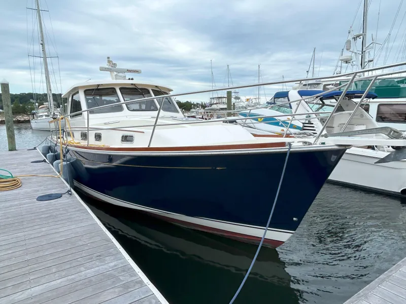 Slide: The Image of 2006 Sabre 38 Express HDTP MY yacht bathroom with shower, sink, and toilet. - 4