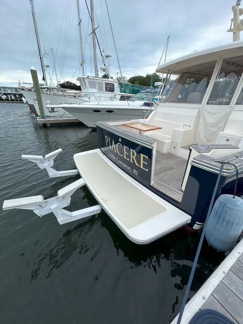 Slide: The Image of 2006 Sabre 38 Express HDTP MY boat docked in calm waters. - 5