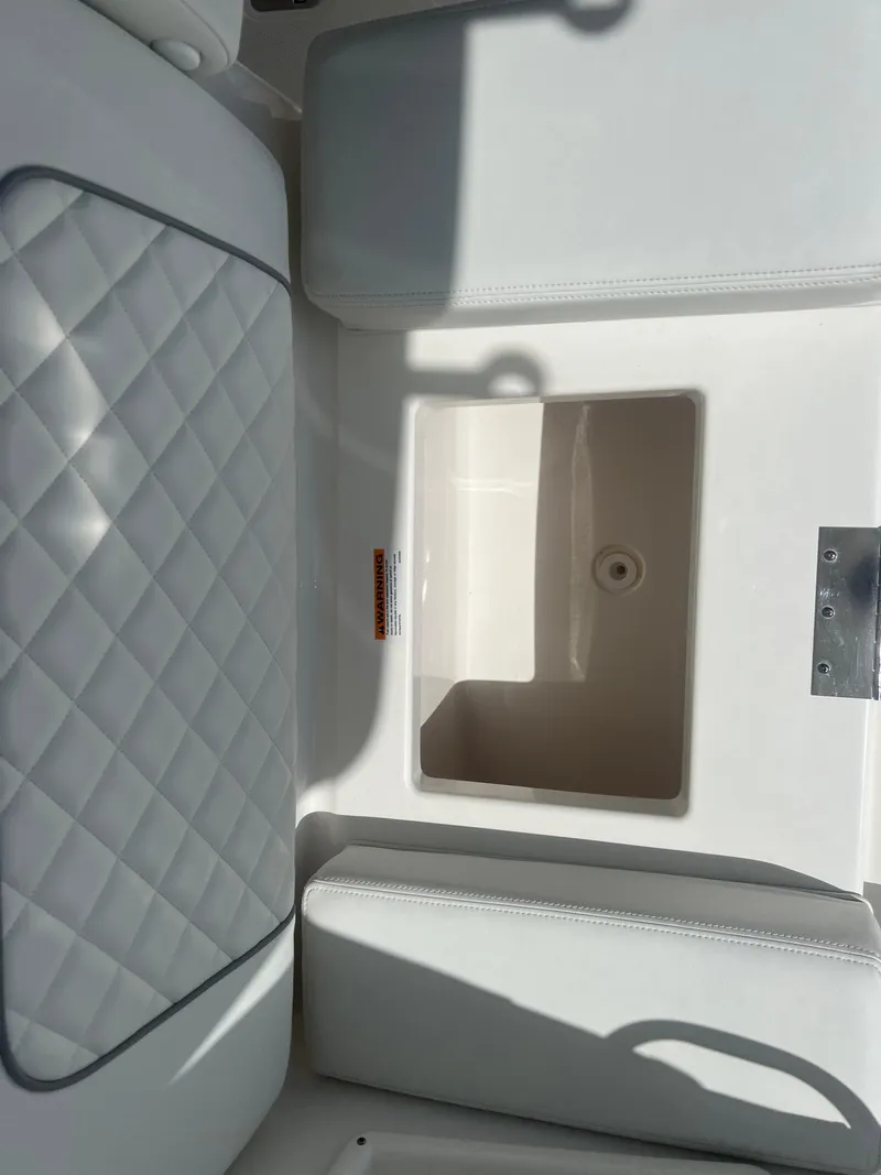 Slide: The Image of 2024 Pursuit DC 306 Dual Console boat seat with storage compartment. - 18