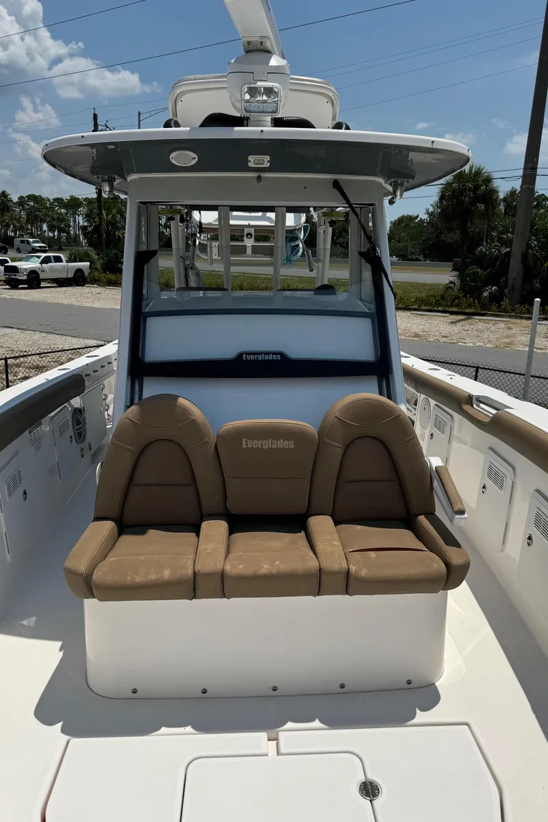 Slide: The Image of 2013 Everglades 355 Tournament boat with tan seating and sleek design. - 12
