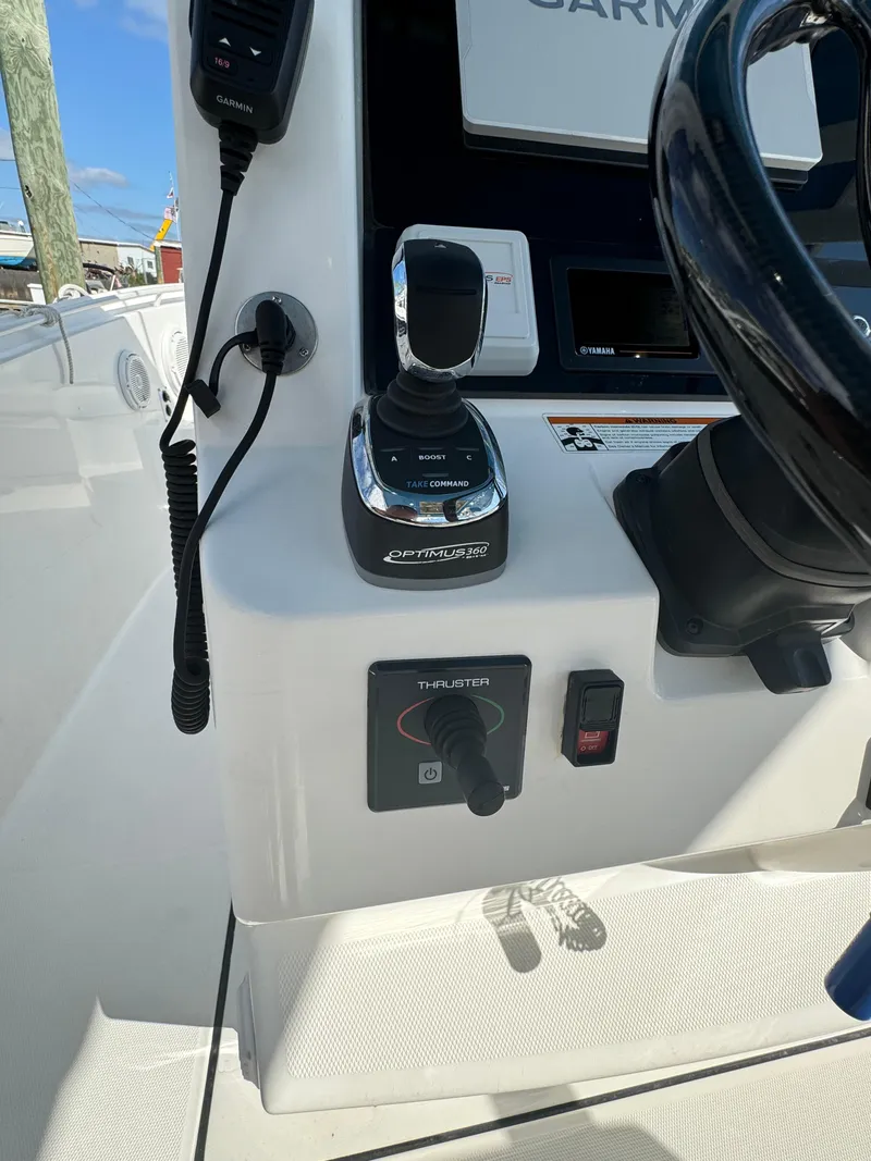 Slide: The Image of Edgewater 280CC 2019 boat console with joystick and controls. - 28