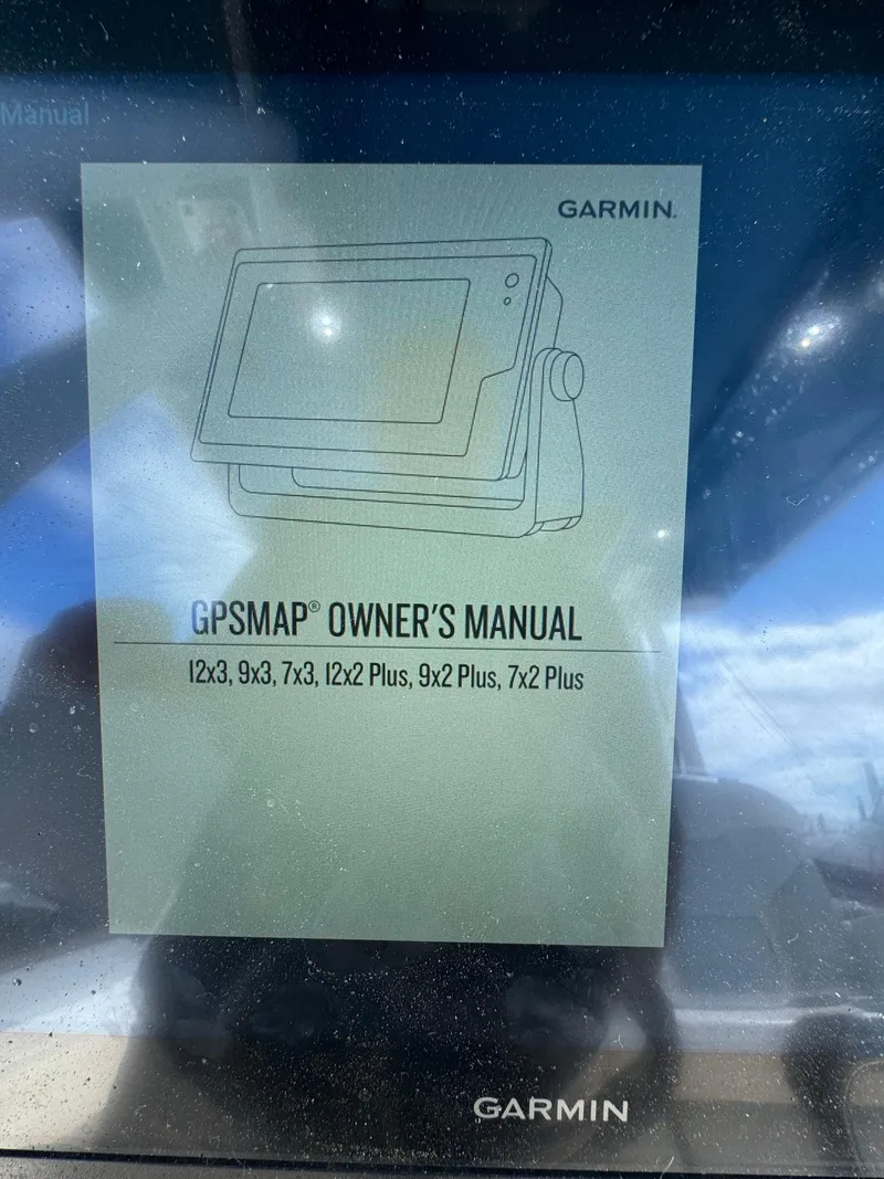 Slide: The Image of Garmin GPSMAP owner's manual displayed on Edgewater 280CC, 2019 model. - 31