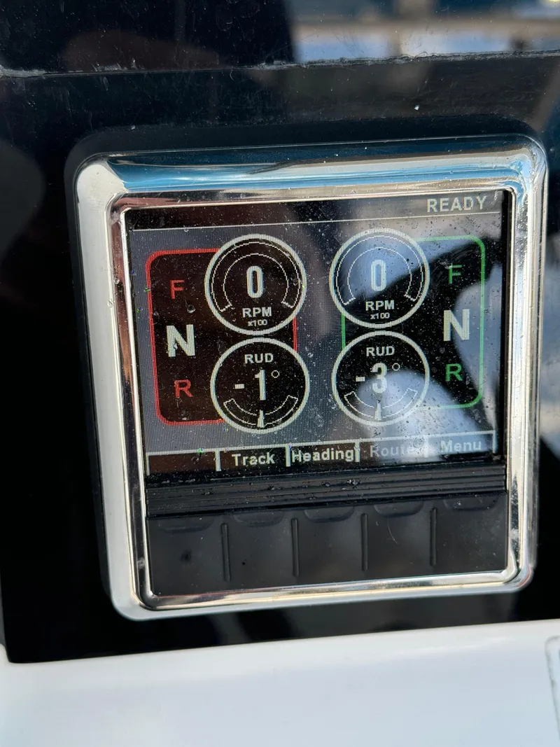 Slide: The Image of Edgewater 280CC 2019 boat control panel with RPM and rudder indicators. - 33