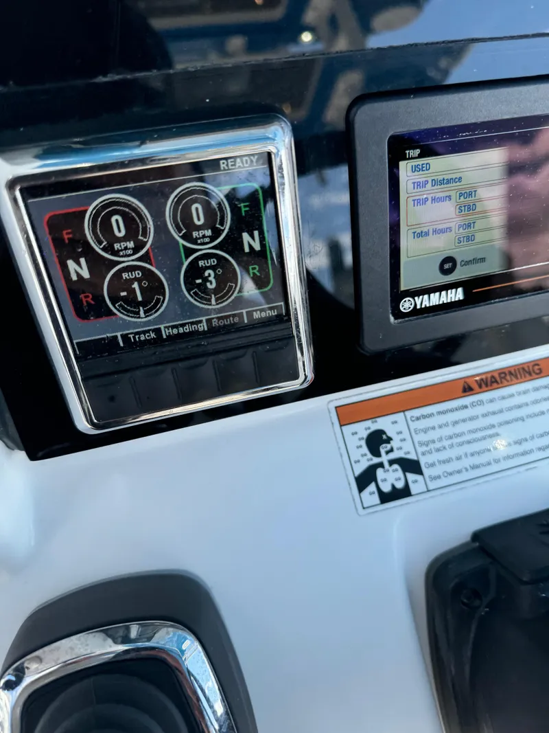 Slide: The Image of Edgewater 280CC 2019 boat dashboard with Yamaha display and controls. - 34