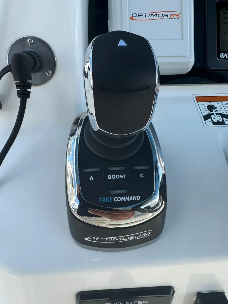 Slide: The Image of Optimus 360 joystick control on 2019 Edgewater 280CC boat dashboard. - 35