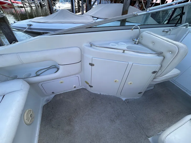 Slide: The Image of Interior of 2000 Crownline 266 CCR boat with seating and storage compartments. - 10