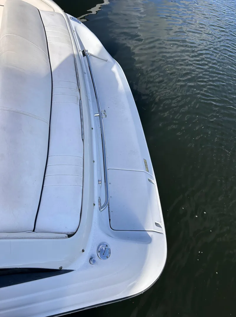 Slide: The Image of 2000 Crownline 266 CCR boat on calm water, top view. - 2