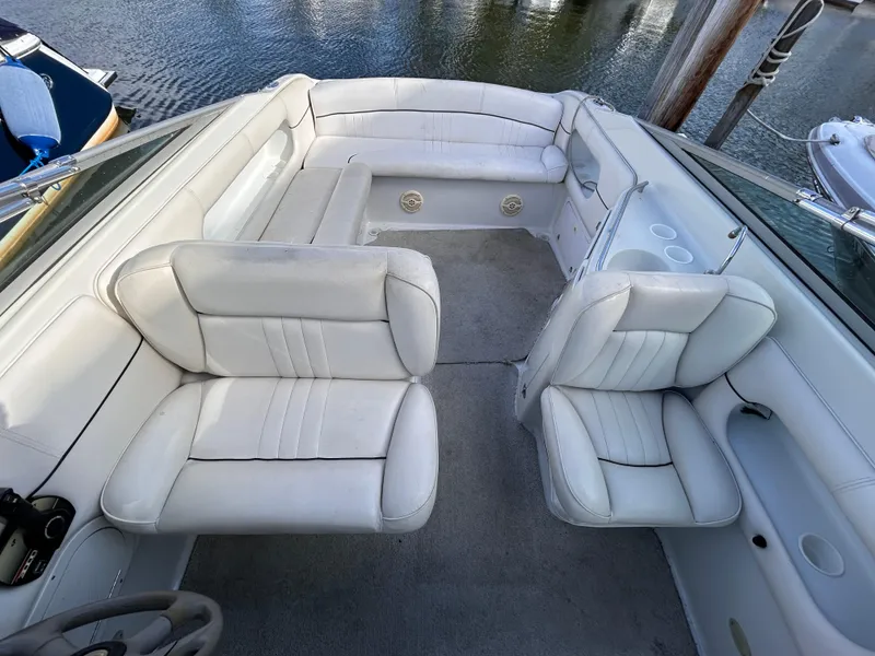 Slide: The Image of 2000 Crownline 266 CCR boat interior with white leather seating and spacious layout. - 9