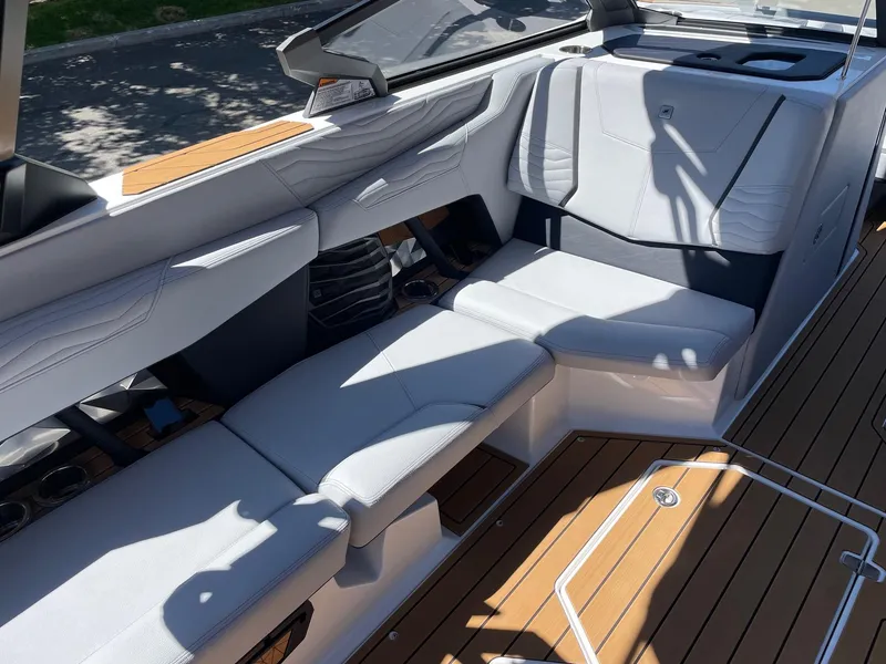Slide: The Image of 2025 Nautique G23 boat interior with sleek seating and modern design. - 10