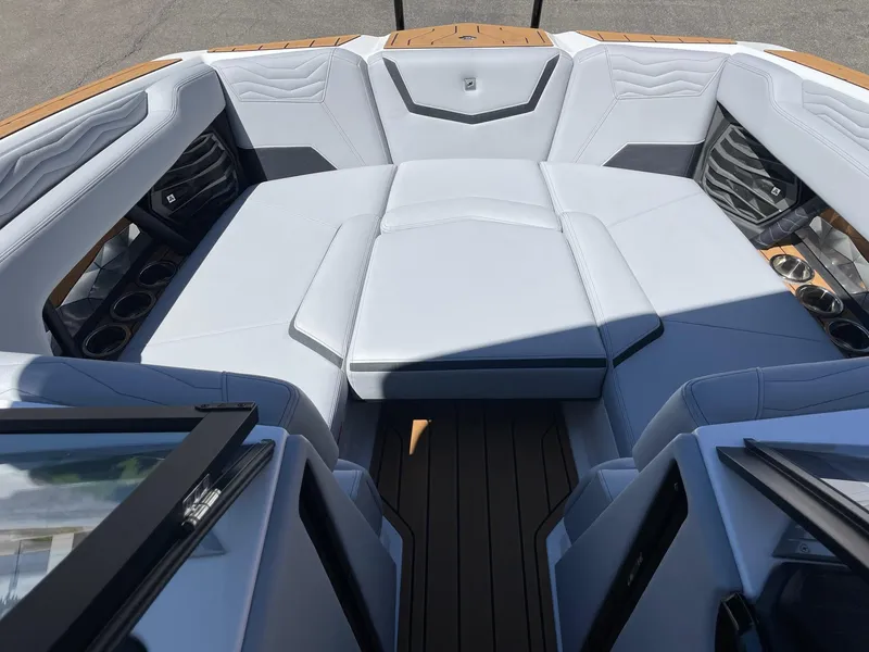 Slide: The Image of 2025 Nautique G23 boat interior with luxurious seating and modern design. - 11