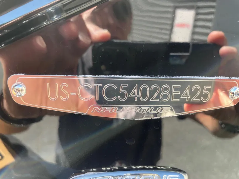 Slide: The Image of 2025 Nautique G23 boat identification plate with serial number. - 13