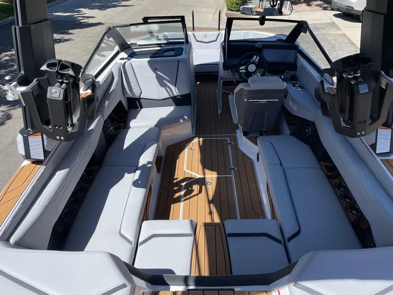 Slide: The Image of 2025 Nautique G23 boat interior with sleek seating and modern design. - 5