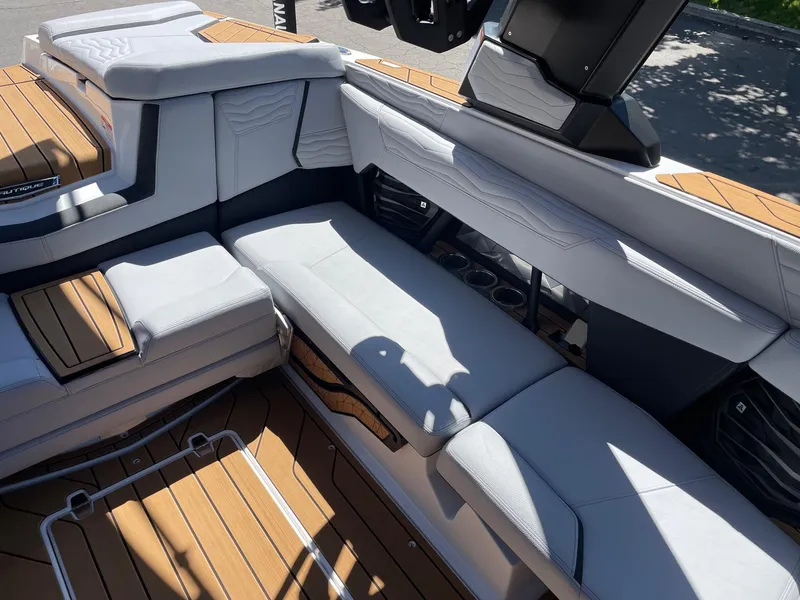 Slide: The Image of 2025 Nautique G23 boat interior with sleek seating and modern design. - 9