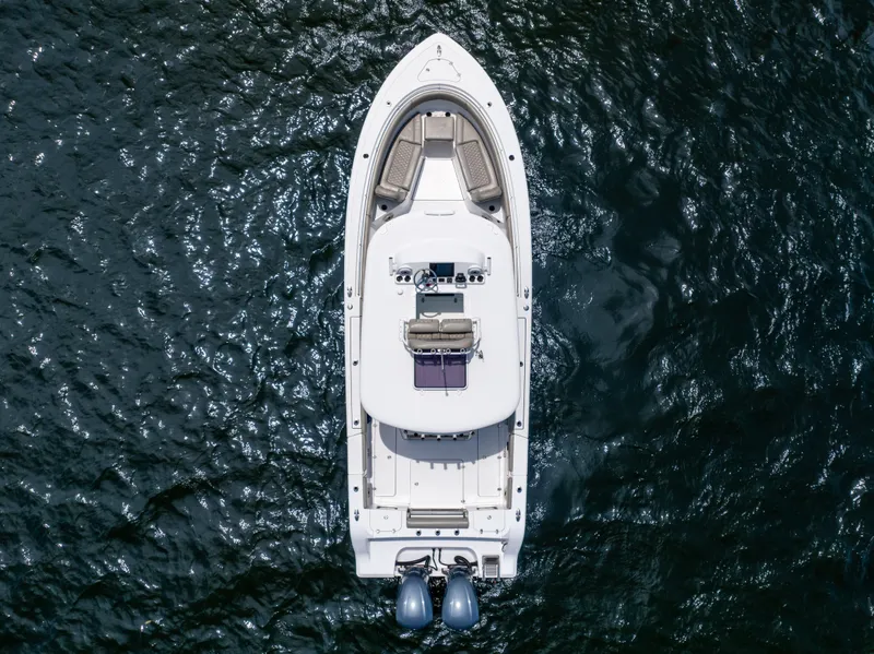 Slide: The Image of Aerial view of 2021 Sportsman Open 302 Center Console boat on water. - 14