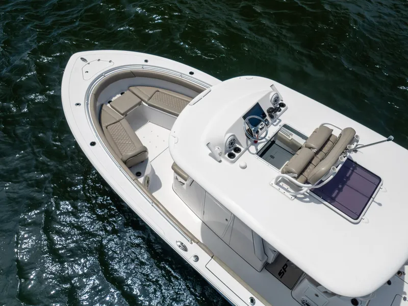 Slide: The Image of 2021 Sportsman Open 302 Center Console boat on water, aerial view. - 15