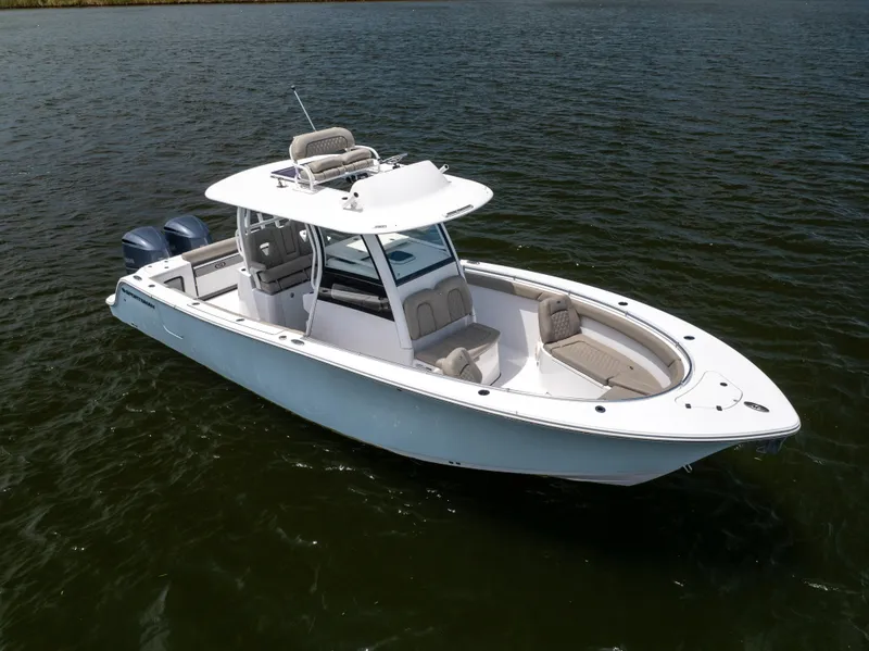 Slide: The Image of 2021 Sportsman Open 302 Center Console boat on water. - 20