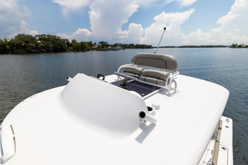Slide: The Image of 2021 Sportsman Open 302 Center Console boat on a serene lake. - 42