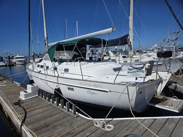 Slide: The Image of 2003 Beneteau 42CC Oceanis Clipper sailboat docked at marina. - 1