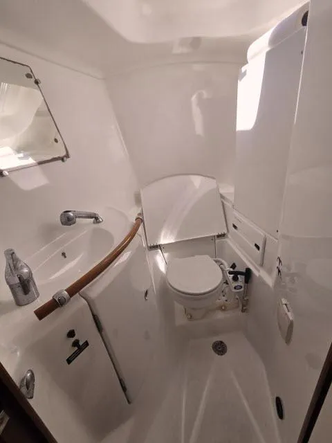 Slide: The Image of Beneteau 42CC Oceanis Clipper 2003 yacht bathroom with sink and toilet. - 15