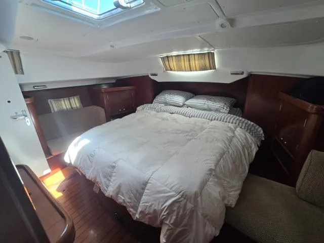 Slide: The Image of Cozy bedroom in 2003 Beneteau 42CC Oceanis Clipper yacht with natural light. - 17