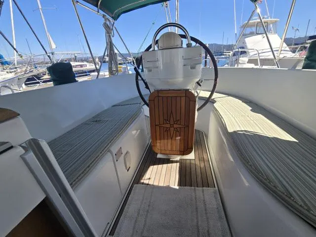 Slide: The Image of 2003 Beneteau 42CC Oceanis Clipper cockpit with steering wheel and seating. - 20