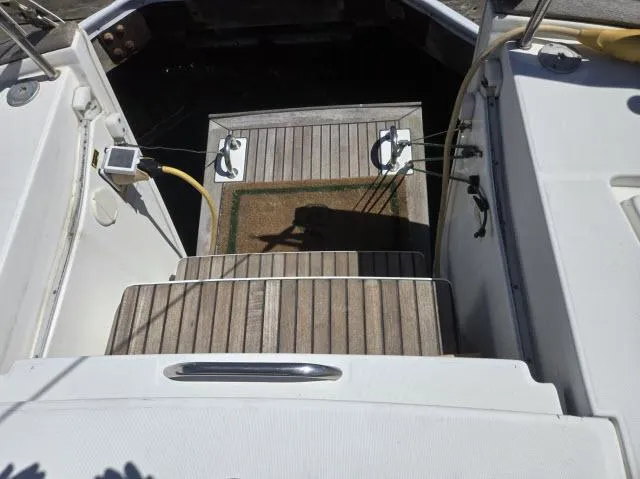 Slide: The Image of Beneteau 42CC Oceanis Clipper 2003 yacht deck with wooden steps and cockpit view. - 28