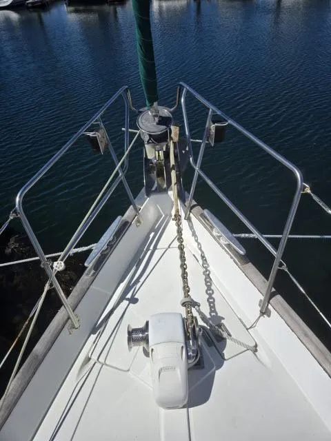 Slide: The Image of Bow of 2003 Beneteau 42CC Oceanis Clipper sailboat with anchor and railing. - 29