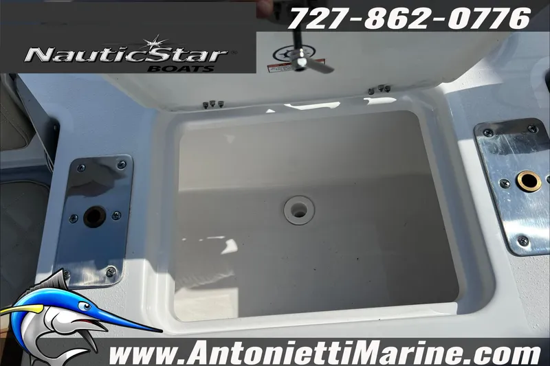 Slide: The Image of 2025 NauticStar 194 Bay boat compartment with contact details and logo. - 15