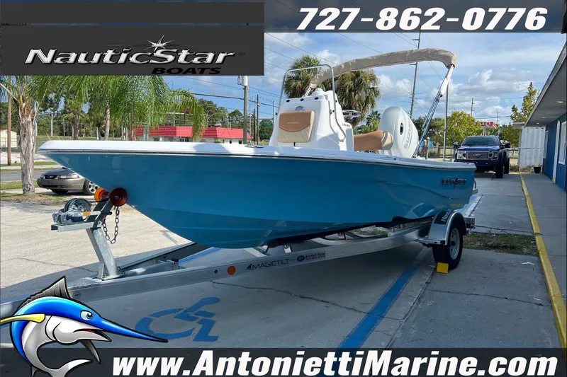 Slide: The Image of 2025 NauticStar 194 Bay boat on trailer at Antonietti Marine dealership. - 2