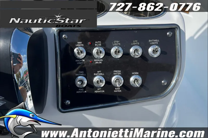 Slide: The Image of Control panel of 2025 NauticStar 194 Bay boat with various switches and logo. - 20