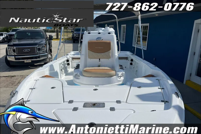 Slide: The Image of 2025 NauticStar 194 Bay boat displayed at Antonietti Marine dealership. - 26