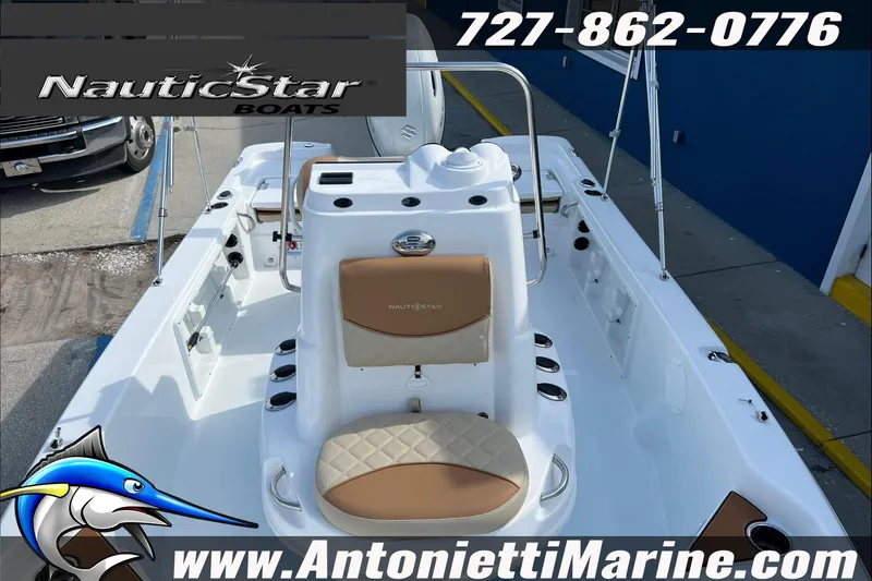 Slide: The Image of 2025 NauticStar 194 Bay boat interior with seating, showcased at Antonietti Marine. - 5