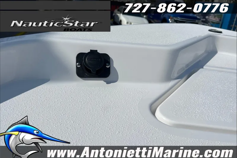 Slide: The Image of 2025 NauticStar 194 Bay boat deck with logo and contact information. - 8