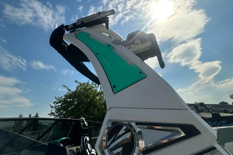 Slide: The Image of 2022 Tigé Z3 boat with sleek design under a bright sky. - 15