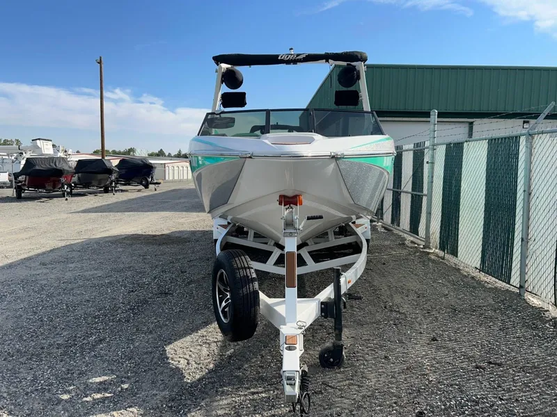 Slide: The Image of 2022 Tigé Z3 boat on trailer in outdoor storage area. - 3