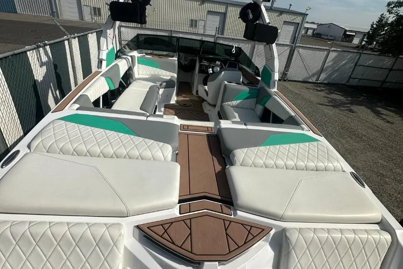 Slide: The Image of 2022 Tigé Z3 boat with luxurious white seating and teal accents. - 7