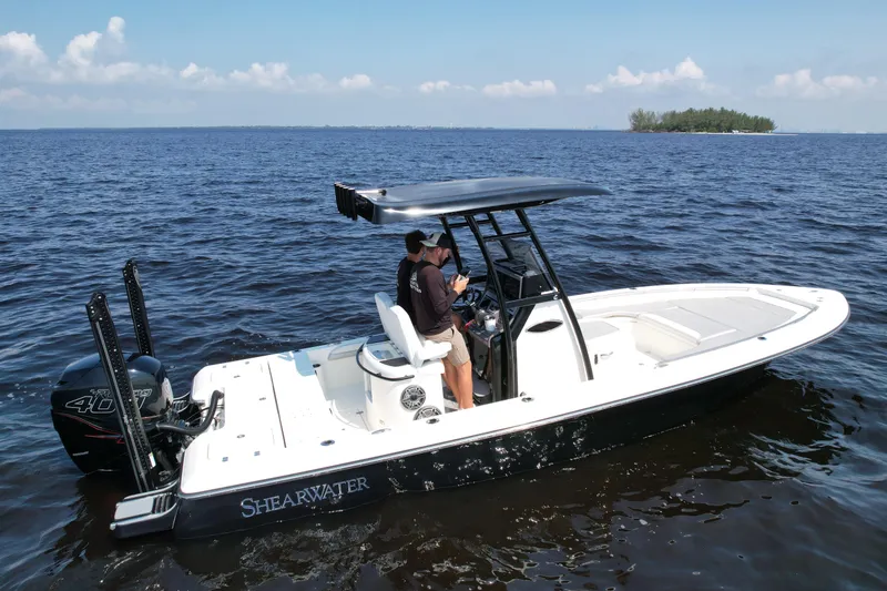 Slide: The Image of 2022 ShearWater 270 Carolina Flare boat on open water, side view. - 0