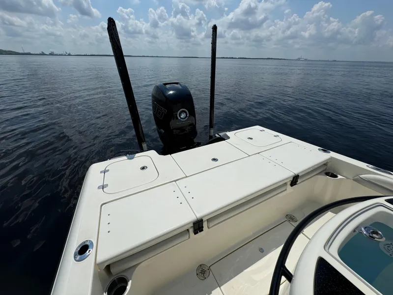 Slide: The Image of 2022 ShearWater 270 Carolina Flare boat on calm water, rear view. - 17