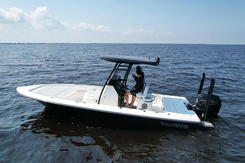 Slide: The Image of 2022 ShearWater 270 Carolina Flare boat on open water, side view. - 4