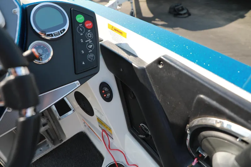 Slide: The Image of 2018 Ranger 521C boat dashboard with controls and gauges. - 13