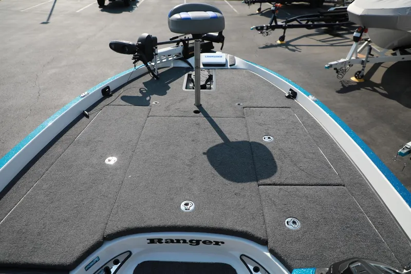 Slide: The Image of 2018 Ranger 521C boat deck with seating and storage compartments. - 14