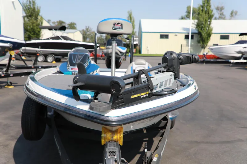 Slide: The Image of 2018 Ranger 521C boat with trolling motor in a marina setting. - 4