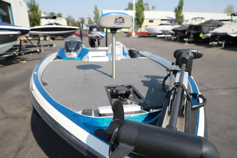 Slide: The Image of 2018 Ranger 521C fishing boat with trolling motor, parked outdoors. - 8
