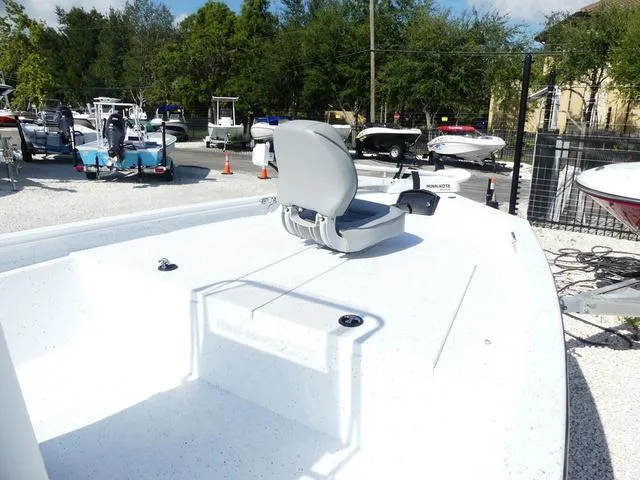 Slide: The Image of 2025 Xpress Boats H190B center console in a boatyard. - 11