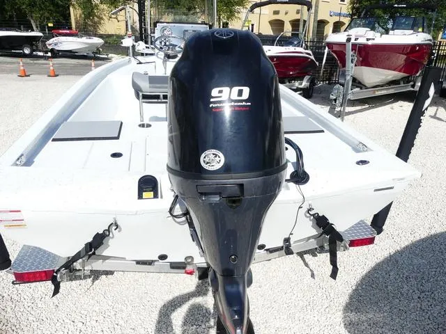 Slide: The Image of 2025 Xpress Boats H190B on trailer, featuring Yamaha engine, displayed outdoors. - 6