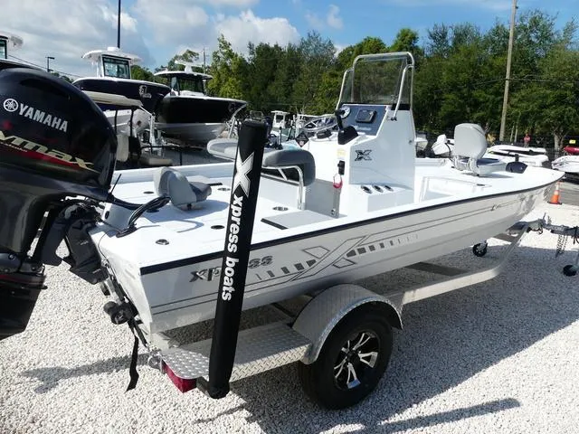 Slide: The Image of 2025 Xpress Boats H190B with Yamaha engine, displayed in a boat showroom. - 7