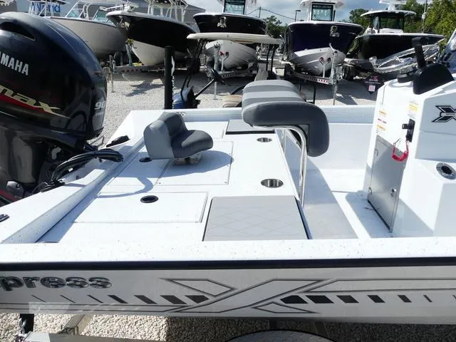 Slide: The Image of 2025 Xpress Boats H190B console with steering wheel and navigation controls. - 8