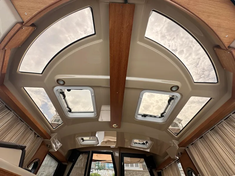 Slide: The Image of Interior view of 2019 Ranger Tugs R-23 boat ceiling with skylights. - 28
