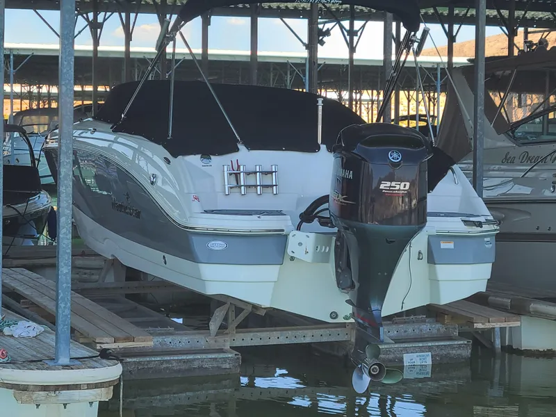 Slide: The Image of 2021 NauticStar 243 DC boat docked with Yamaha 250 outboard motor. - 4